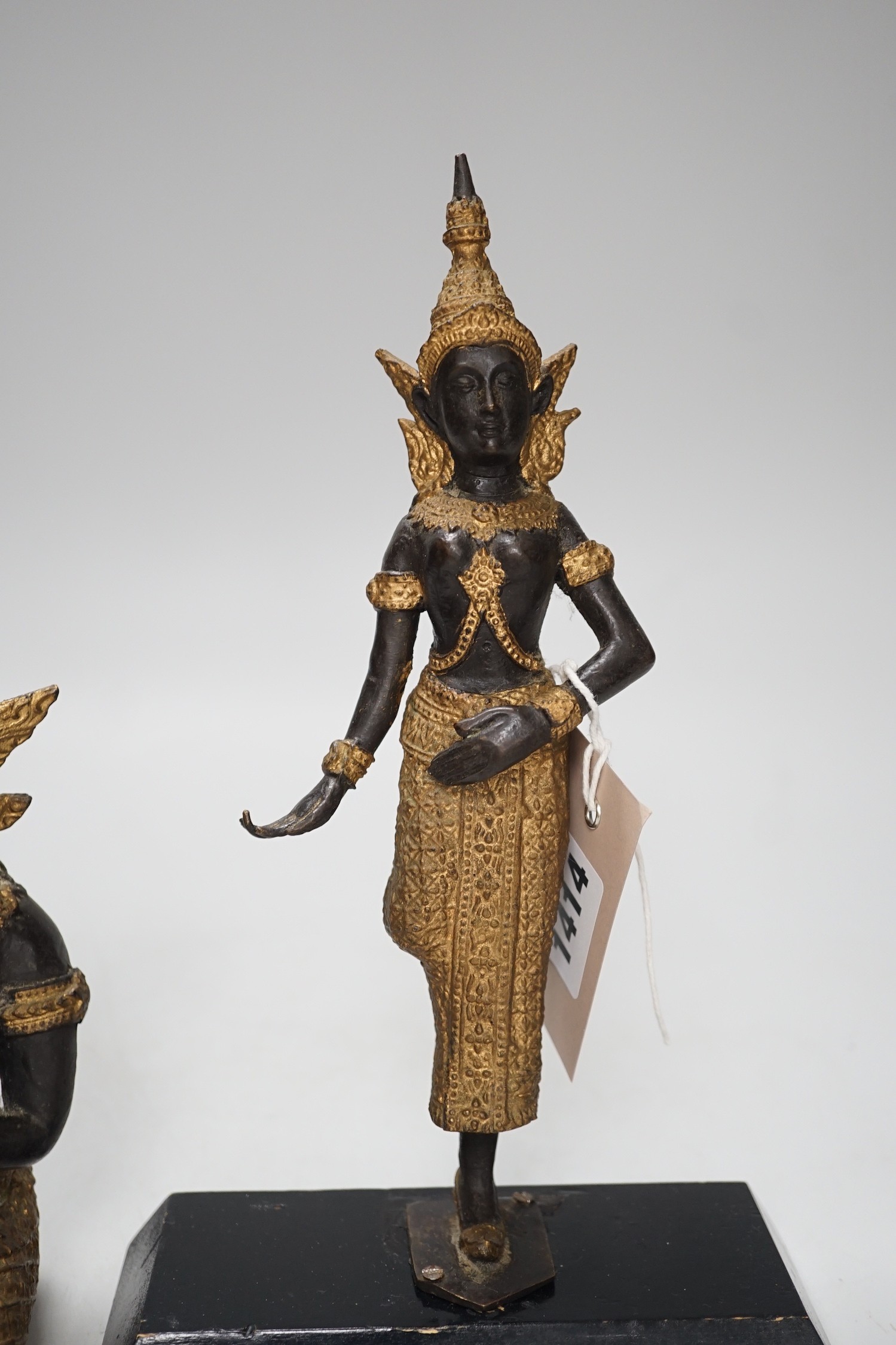 Two two colour Thai patinated metal figures and a hollow cast leopard. Tallest 25cm